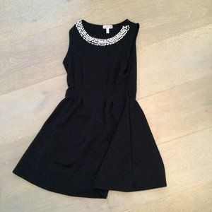 Black dress with a pearl neck line
